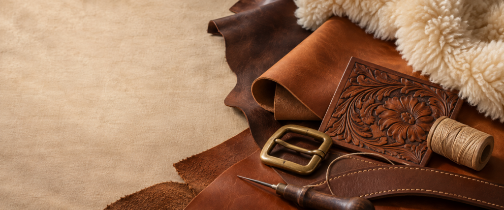 Tooled leather, brass hardware and soft sheepskin.